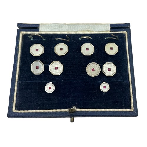 43 - A cased octagonal white gold, mother of pearl and ruby cufflinks, button and studs set, S J Rose & S... 