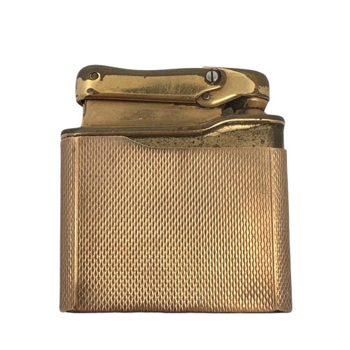 291 - A Calibri Monogas lighter in a 9ct gold engine turned case . Calibri stamp and hallmarks to base. To... 