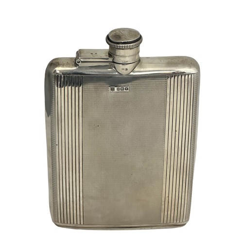 110 - A silver hip flask with engine turned decoration by Charles S Green & Co Ltd Birmingham 1948. Dimens... 