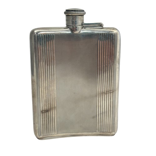 110 - A silver hip flask with engine turned decoration by Charles S Green & Co Ltd Birmingham 1948. Dimens... 