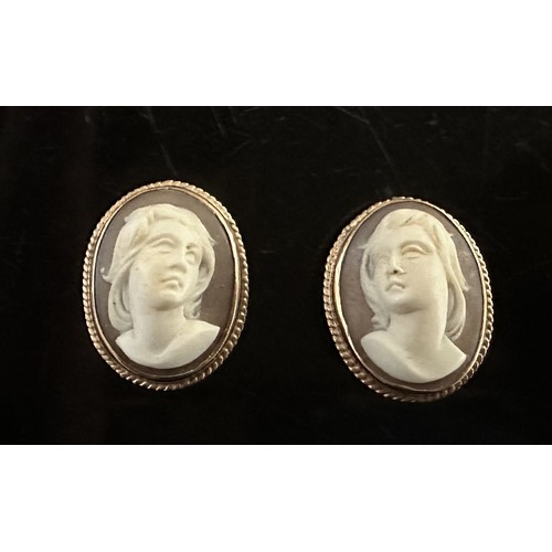 33 - A pair of shell cameo earrings with rope twist surround. Stamped 9ct. Length 2cm. Weight 8.85g.

Ple... 