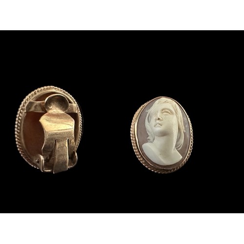 33 - A pair of shell cameo earrings with rope twist surround. Stamped 9ct. Length 2cm. Weight 8.85g.

Ple... 