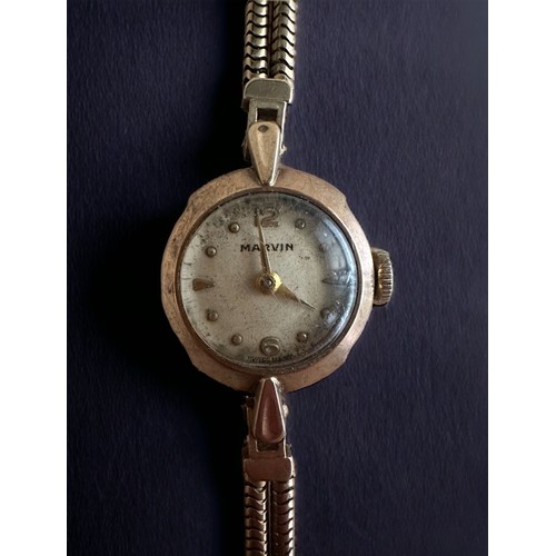 83 - Marvin, a Marvin ladies circular 9ct gold watch with Arabic numerals. On a hallmarked 9ct gold twin ... 