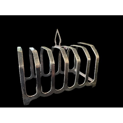 116 - A silver six slice toast rack by J. Collyer, Birmingham 1938.