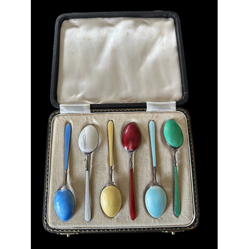 117 - A cased set of hallmarked six silver and enamel tea spoons.