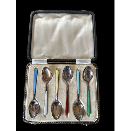 117 - A cased set of hallmarked six silver and enamel tea spoons.