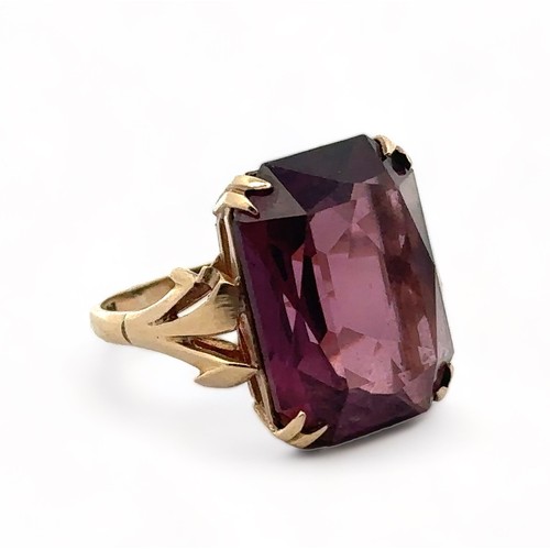 2 - A modern dress ring set with an octagonal purple paste gemstone, imitating amethyst. Paste stone mea... 