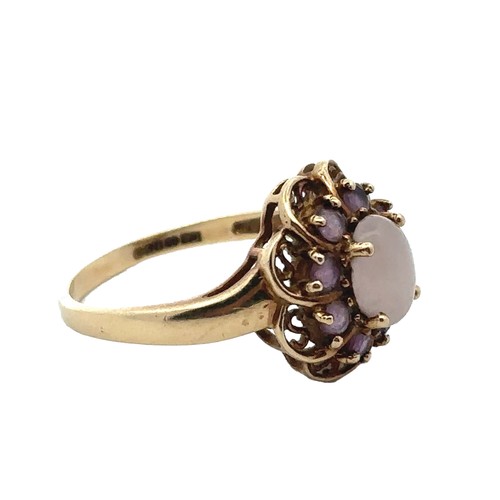 1 - An amethyst and white cabochon stone cluster ring, hallmarked 9ct gold. Size R.  Weight 3.58g.

Plea... 