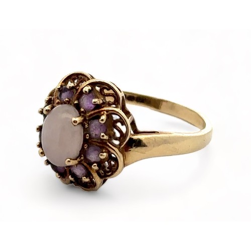 1 - An amethyst and white cabochon stone cluster ring, hallmarked 9ct gold. Size R.  Weight 3.58g.

Plea... 