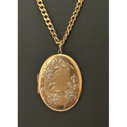 41 - A hallmarked 9ct gold oval locket with a bi-coloured flower design. Suspended from a hallmarked 20