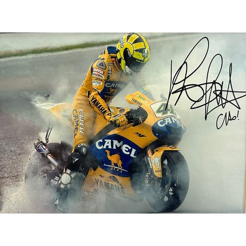 417 - Framed signed picture of Valentino Rossi doing a burnout on his Yamaha motorbike. No COA. Frame dime... 