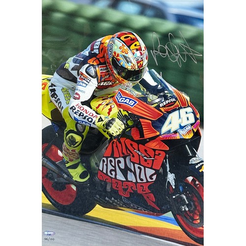 415 - Framed Valentino Rossi signed picture. Valentino Rossi pictured on a Repsol motorbike. With chrome n... 