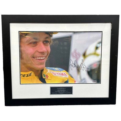 421 - Framed signed Valentino Rossi close up picture. Large picture with plaque to bottom of frame. Descri... 