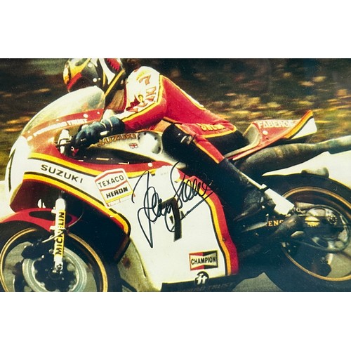 427 - Framed signed Barry Sheene picture. Barry Sheene on a Suzuki motorcycle. COA from Heroes Memorabilia... 