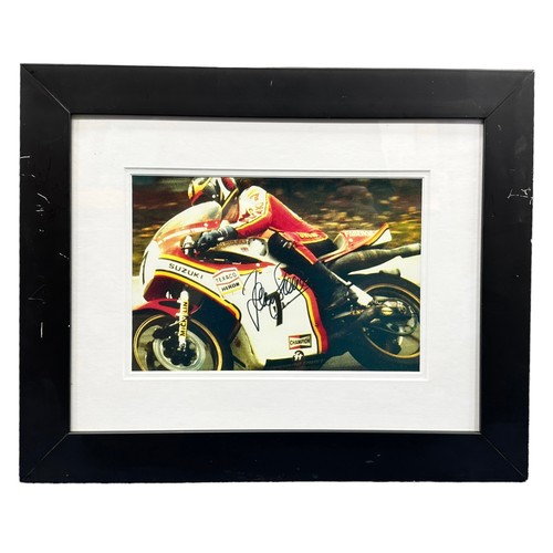 427 - Framed signed Barry Sheene picture. Barry Sheene on a Suzuki motorcycle. COA from Heroes Memorabilia... 