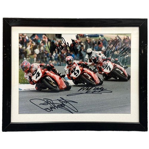 428 - Framed Ducati Team signed picture “3 Dukes”. Signed by Carl Fogarty, Neil Hodgson, Aaron Slight & Pi... 