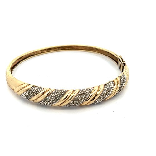 13 - Three 9ct gold and diamond bangles. 

Please see the buyer's terms and conditions for purchasing dia... 