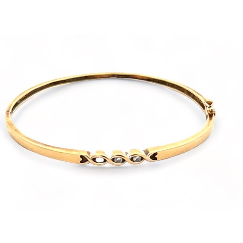 13 - Three 9ct gold and diamond bangles. 

Please see the buyer's terms and conditions for purchasing dia... 