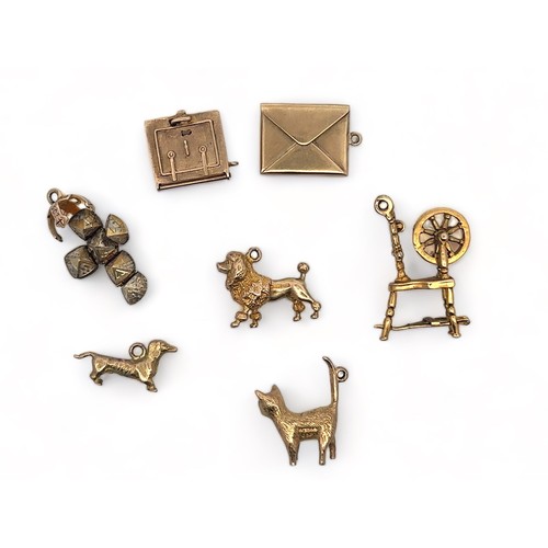 47 - A range of seven gold charms. Six fully hallmarked, one (orb) marked '9ct and Sil'. Also includes an... 