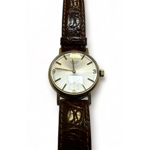 81 - Longines, a 1970's Longines 9ct gentleman's wristwatch, the signed 31mm dial with gilt baton markers... 