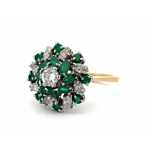 38 - An 18ct and platinum emerald and diamond cluster ring. The principal diamond estimated at 0.36ct is ... 