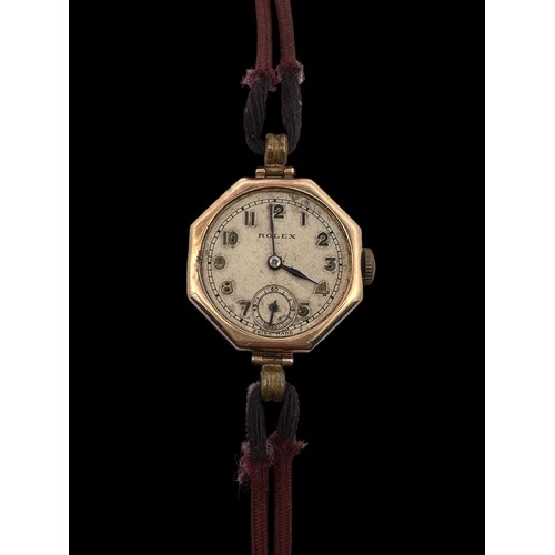 67 - Rolex - an octagonal 9ct gold Rolex watch, circa 1940. 15 rubies, Arabic numerals, subsidiary dial, ... 