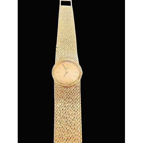 72 - Omega - A ladies Omega 18ct gold watch with hallmarked 18ct gold bracelet. Gold toned dial with bato... 