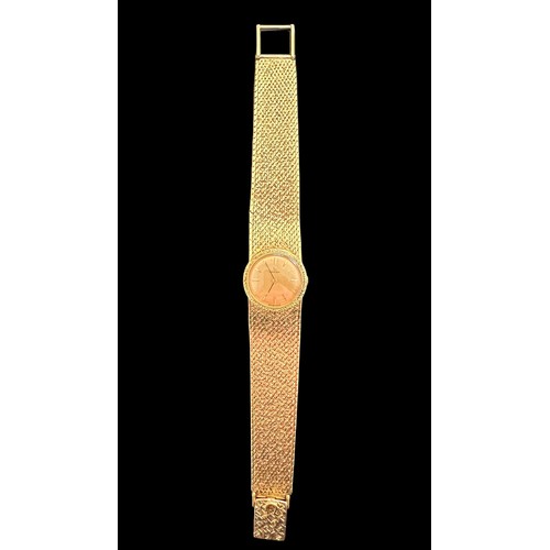 72 - Omega - A ladies Omega 18ct gold watch with hallmarked 18ct gold bracelet. Gold toned dial with bato... 