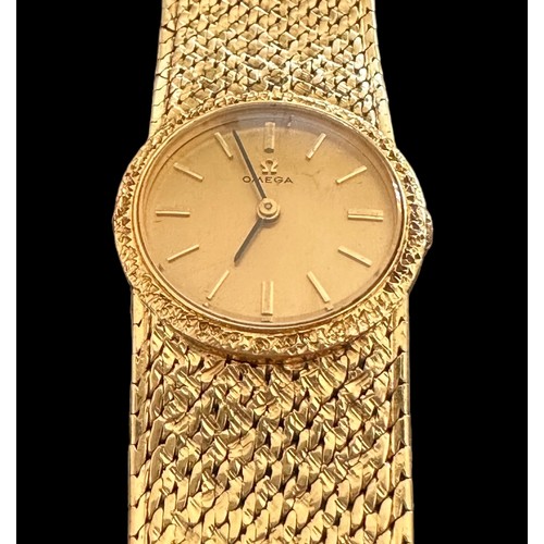 72 - Omega - A ladies Omega 18ct gold watch with hallmarked 18ct gold bracelet. Gold toned dial with bato... 