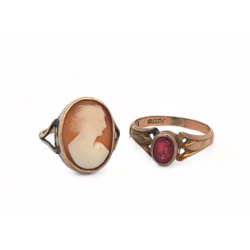 25 - Two gold rings. A red stone ring (stone very badly damaged), marked for maker A.G.G  and stamped '9 ... 