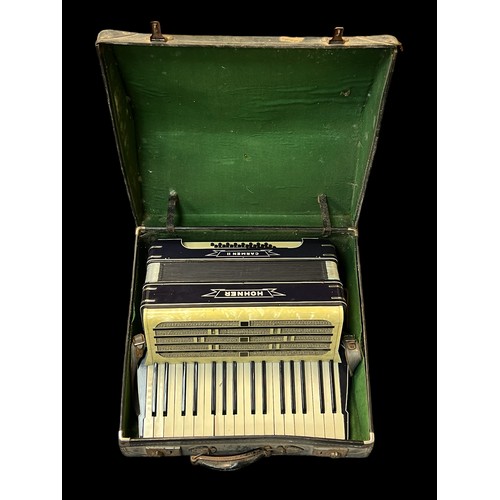 298 - A Hohner Carmen II piano accordion in fitted case.