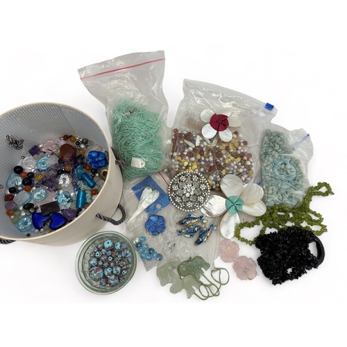 62 - Mixed box of beads and gemstones, some fancy-shaped for use in making jewellery. Includes amethyst, ... 