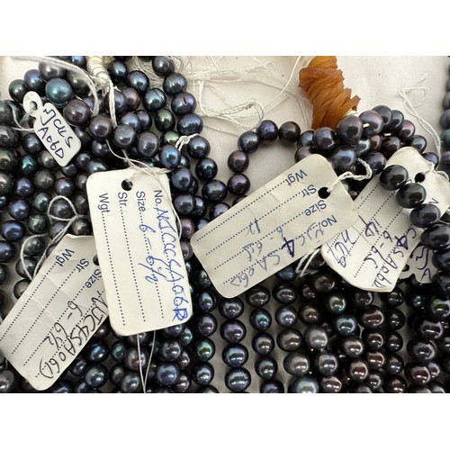 61 - A large quantity of cultured pearl strands for jewellery making. Pearl sizes and shapes vary.  Colou... 