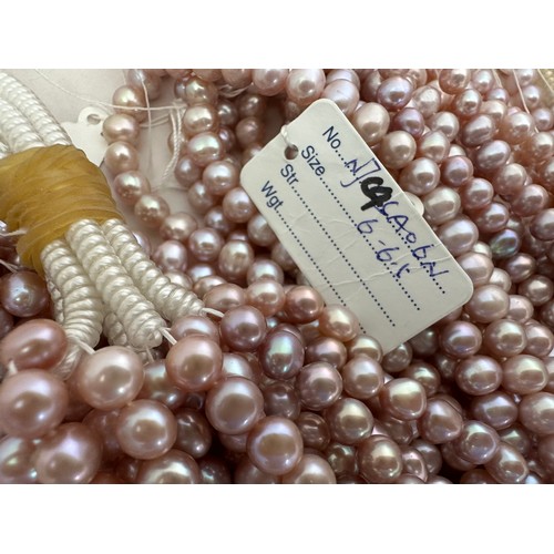 61 - A large quantity of cultured pearl strands for jewellery making. Pearl sizes and shapes vary.  Colou... 