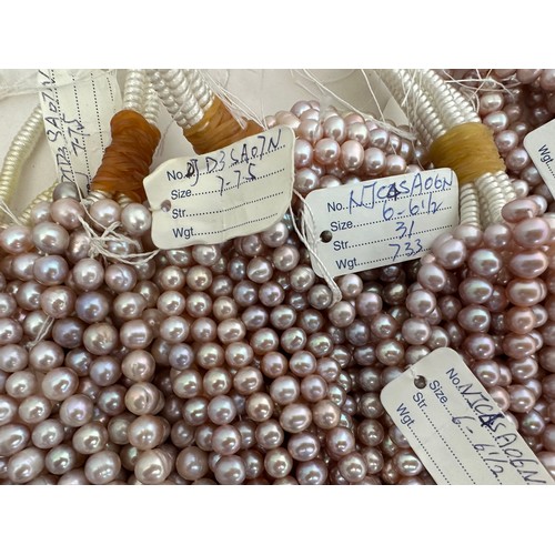 61 - A large quantity of cultured pearl strands for jewellery making. Pearl sizes and shapes vary.  Colou... 