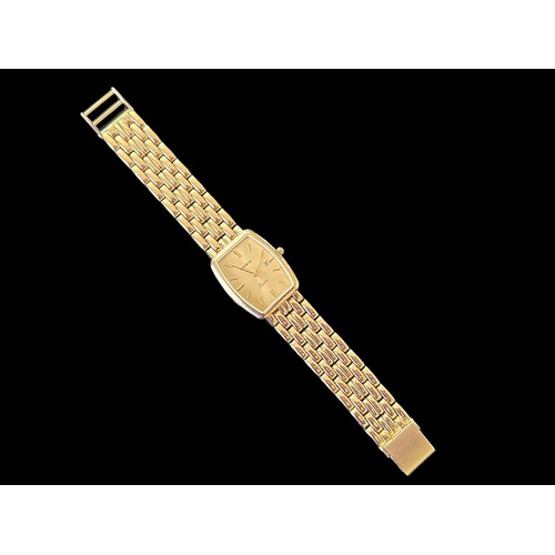 74A - Geneve, a 14k gold wristwatch, gold coloured rectangular dial with gold coloured batons and hands, c... 