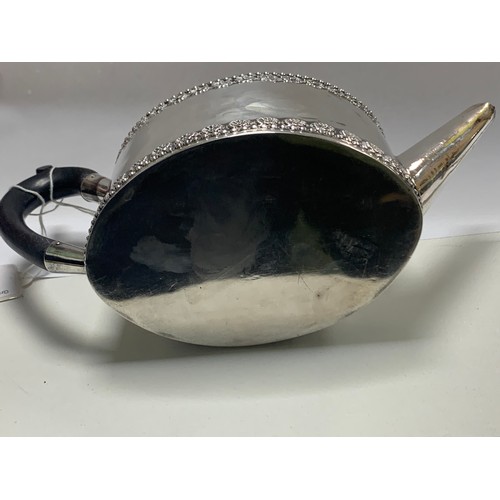 107 - A silver bachelor's teapot of straight sided oval form, ebonised wood handle and finial.  Fordham & ... 