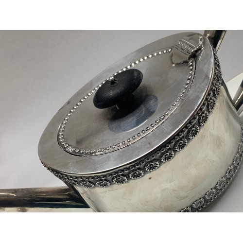 107 - A silver bachelor's teapot of straight sided oval form, ebonised wood handle and finial.  Fordham & ... 