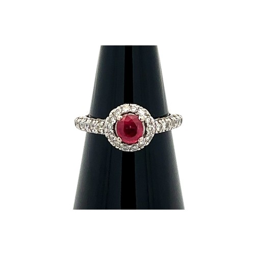 6 - A 14ct white gold ruby and diamond cluster ring, size M/N.  Ruby estimated at 0.6ct, estimated diamo... 