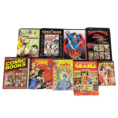 516 - Miscellaneous collection of hardback books on comics. Books are The standard catalog of comic books ... 