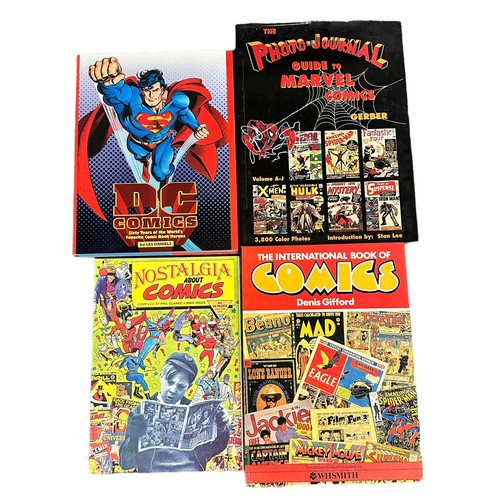 516 - Miscellaneous collection of hardback books on comics. Books are The standard catalog of comic books ... 