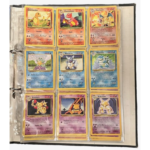 415 - A folder containing 152 Pokemon cards from 1999 Base Set, Jungle and Base Set 2. Including a Holo Ch... 