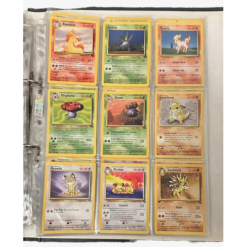 415 - A folder containing 152 Pokemon cards from 1999 Base Set, Jungle and Base Set 2. Including a Holo Ch... 