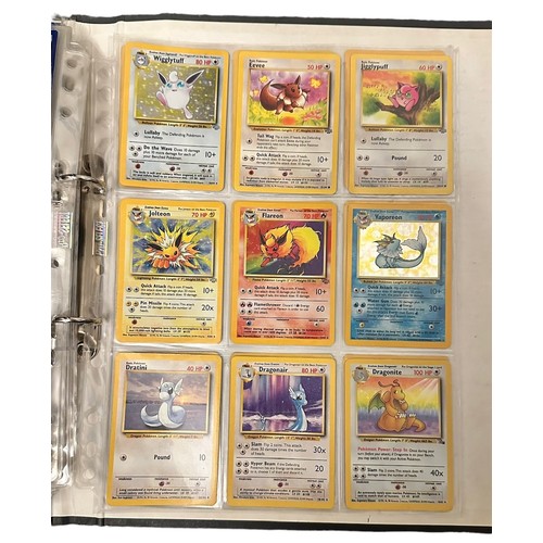 415 - A folder containing 152 Pokemon cards from 1999 Base Set, Jungle and Base Set 2. Including a Holo Ch... 