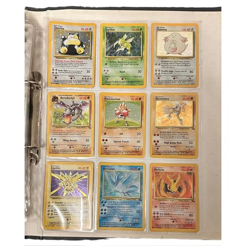 415 - A folder containing 152 Pokemon cards from 1999 Base Set, Jungle and Base Set 2. Including a Holo Ch... 