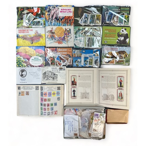 421A - Accumulation of tea cards, postcards and stamps with many Brooke Bond albums and loose complete/part... 