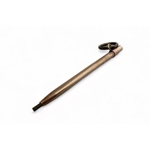 276 - A rose gold propelling pencil with turquoise cabochon termination 5g.