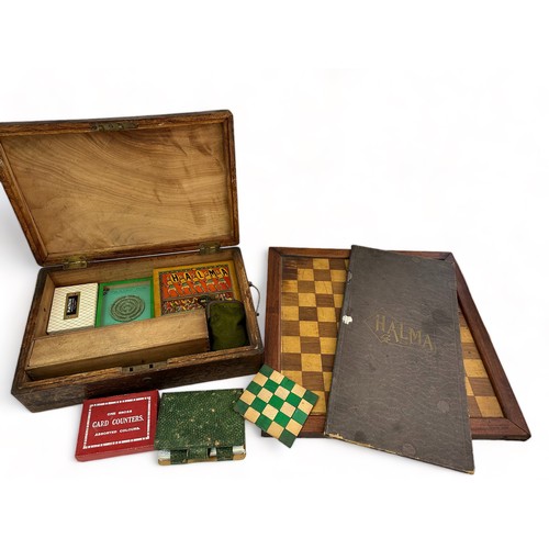 238 - A wooden box containing a selection of vintage board games and card games etc. Includes Halma, domin... 