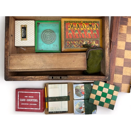 238 - A wooden box containing a selection of vintage board games and card games etc. Includes Halma, domin... 