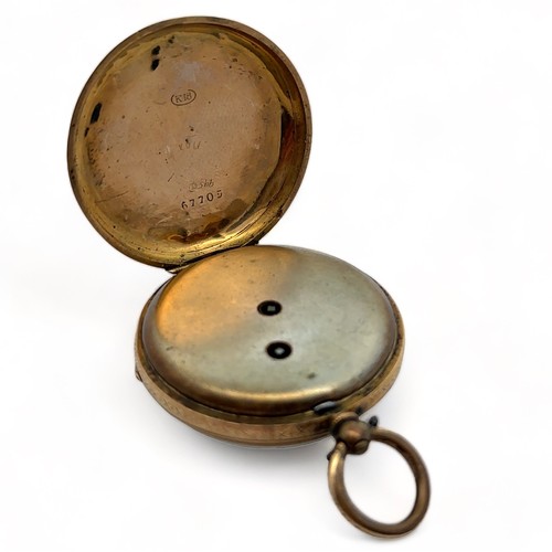 147 - A ladies 18ct gold pocket watch. Gold dial with Roman numeral markers, case diameter 37mm. Stamped K... 